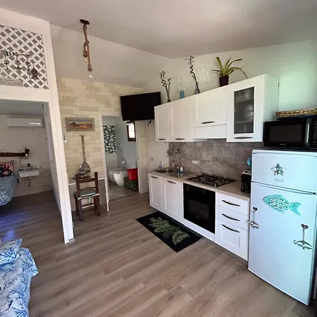 Апартаменты Oasi Del Relax - Seaside Peaceful Panoramic Terrace In Italy - New Sardinia 50 Mt Beach&sea Full Comfort Air Conditioning-wifi-parking-privacy *